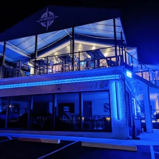 a restaurant lit up at night