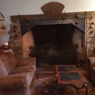 adorable fireplace and couch inside the winery