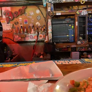 Seafood nachos and behind bar...