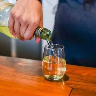 a bartender pouring a drink