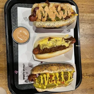 Custom hot dog (shredded cheese, caramelized onion, relish, Harrel's special sauce), chili cheese dog, and Chicago dog