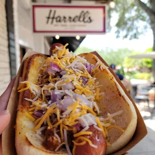 Chili cheese dog on a poppyseed bun