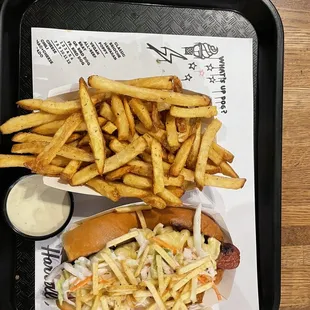 Create your own hot dog with Mac and cheese, coleslaw, and potato straws on a brioche bun, fries, and avocado ranch