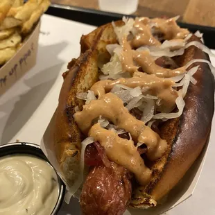 Dog in brioche, chili, onions, kraut, special sauce.
