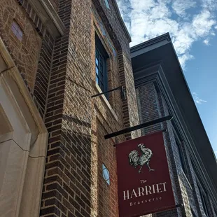a brick building with a sign for harriet brasserie
