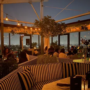 Oversized booth seats with retractable ceiling
