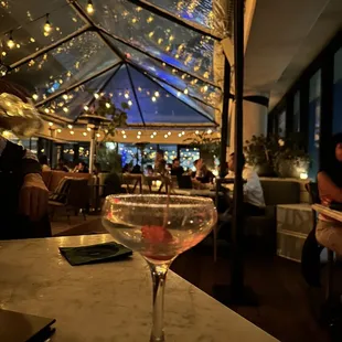 a glass of wine on a table