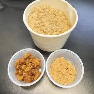 Oatmeal with a side of brown sugar and golden raisins