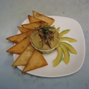 Avocado Hummus - roasted garlic, lemon, avocado, tahini, pita chips