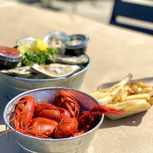 Spicy crawfish, fresh raw oysters, and french fries