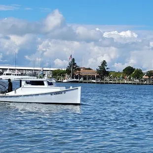 Fishing boat next to restaurant.