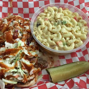 Slaw link with spicy link and spicy BBQ sauce and mac salad.