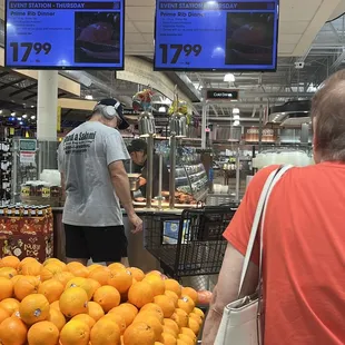 people shopping in a grocery store