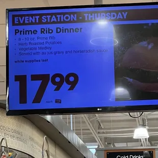 a large tv screen displaying a prime rib dinner