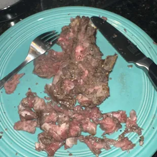 Marinated medium rare cooked steak that was horrible due to the amount of chewy sinew throughout.