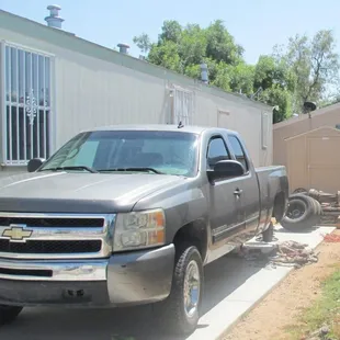 This vehicle sat in this condition for several days. Notice the bars on the darkened windows.