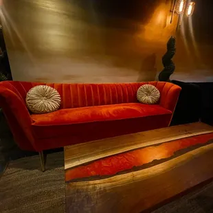 a red couch and coffee table