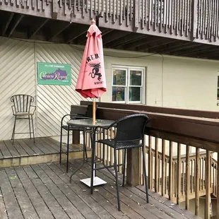 patio with chairs and umbrella