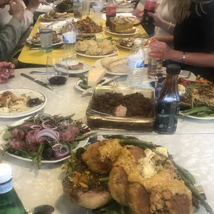 a large group of people sitting at a table