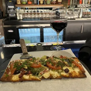 This is a photo of Harry's Restaurant Bar and it's Flatbread appetizer.