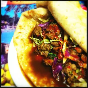 Jerk chicken roti with douses of Harry's fire sauce. The heat is amazing.