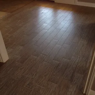 Wood plank porcelain tile installation.