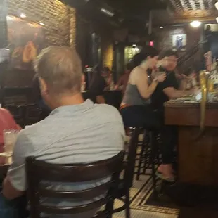 people sitting at the bar