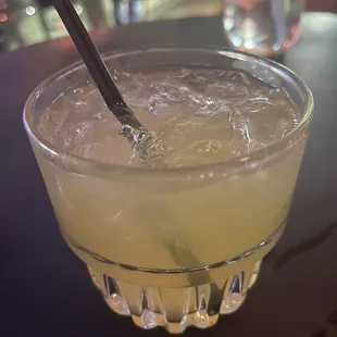a drink in a glass with a spoon