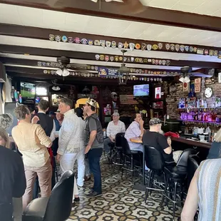a group of people sitting at a bar