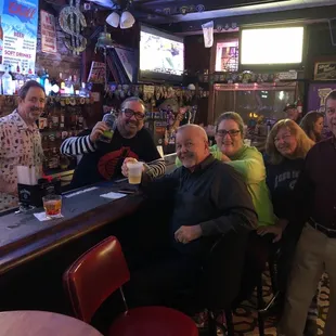 a group of people at a bar
