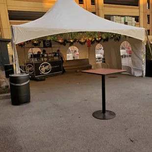 Front Parking lot is set up with an outdoor standing bar. I&apos;m going inside to Eat. Thursday 12/7/2023