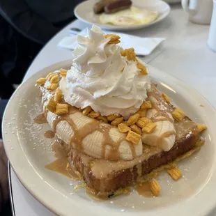 a dessert with bananas and whipped cream