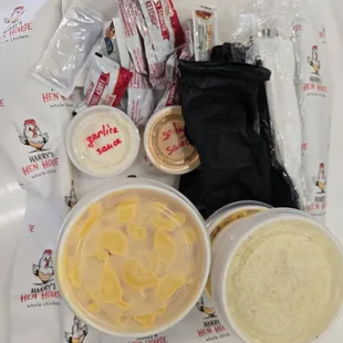 Mac and cheese, rice, two types of sauces (garlic and spicy), ketchup, honey, and gloves