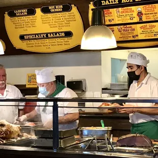 three chefs preparing food