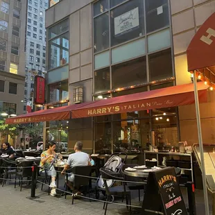 people sitting outside a restaurant