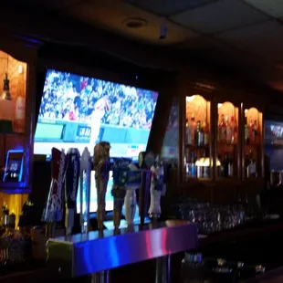 a bar with a television in the back