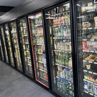 a row of refrigerated drinks