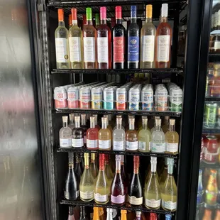 bottles of wine in a refrigerator