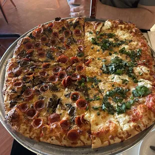 1/2 pepperoni mushroom, 1/2 garlic ricotta basil Extra cheese on the whole thing