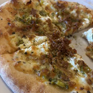 Personal white pizza with ricotta, spicy sausage and jalapeños