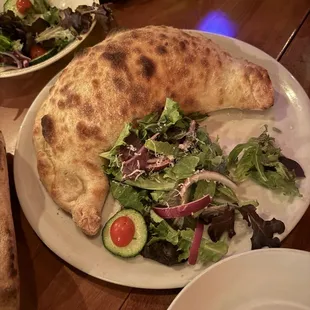 Calzone - massive!  We split between 3 people.  Get extra marinara sauce on side
