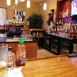 a bar with a television in the background