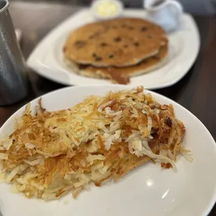 2 stack chocolate chip pancake with a side of hash browns