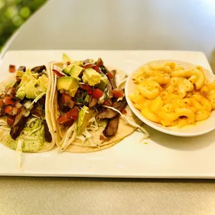 Beef Skirt tacos with a side of Mac and Cheese.