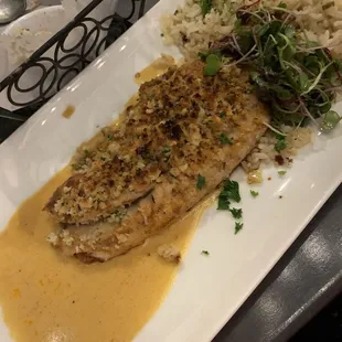 a plate of fish and rice