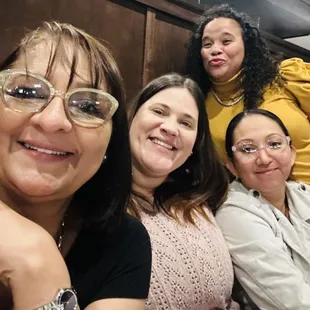 a group of women sitting at a table