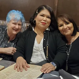 three women sitting at a table