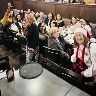 a group of people sitting at a table