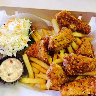 a basket of fried chicken and french fries