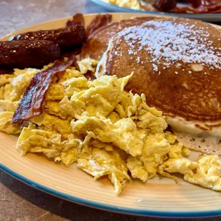 Big bite with scrambled eggs well done &amp; crisp bacon